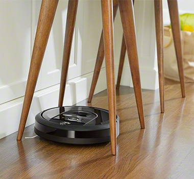 iRobot Roomba i7+ is cleaning under stool